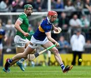 8 May 2022; Dillon Quirke of Tipperary in action against Sean Finn of Limerick during the Munster GAA Hurling Senior Championship Round 3 match between Limerick and Tipperary at TUS Gaelic Grounds in Limerick. Photo by Ray McManus/Sportsfile