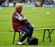 8 May 2022; Photographer Bridget Delaney sits on the team bench before the Munster GAA Hurling Senior Championship Round 3 match between Limerick and Tipperary at TUS Gaelic Grounds in Limerick. Photo by Ray McManus/Sportsfile
