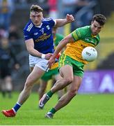 8 May 2022; Odhrán McFadden Ferry of Donegal in action against Conor Brady of Cavan during the Ulster GAA Football Senior Championship Semi-Final match between Cavan and Donegal at St Tiernach's Park in Clones, Monaghan. Photo by Piaras Ó Mídheach/Sportsfile