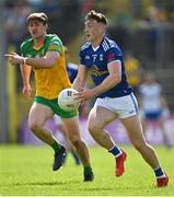 8 May 2022; Conor Brady of Cavan gets away from Hugh McFadden of Donegal during the Ulster GAA Football Senior Championship Semi-Final match between Cavan and Donegal at St Tiernach's Park in Clones, Monaghan. Photo by Piaras Ó Mídheach/Sportsfile