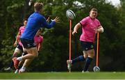 9 May 2022; Tadhg Furlong, right, offoads to Ben Murphy during a Leinster rugby squad training session at UCD in Dublin. Photo by Harry Murphy/Sportsfile