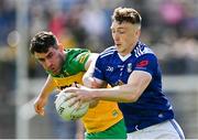 8 May 2022; Conor Brady of Cavan in action against Patrick McBrearty of Donegal during the Ulster GAA Football Senior Championship Semi-Final match between Cavan and Donegal at St Tiernach's Park in Clones, Monaghan. Photo by Piaras Ó Mídheach/Sportsfile