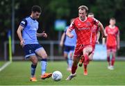 6 May 2022; Evan Osam of UCD and Greg Sloggett of Dundalk during the SSE Airtricity League Premier Division match between UCD and Dundalk at UCD Bowl in Belfield, Dublin. Photo by Ben McShane/Sportsfile