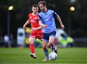 6 May 2022; Mark Dignam of UCD and Lewis Macari of Dundalk during the SSE Airtricity League Premier Division match between UCD and Dundalk at UCD Bowl in Belfield, Dublin. Photo by Ben McShane/Sportsfile