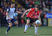 9 May 2022; Matty Smith of Derry City in action against Adam O'Reilly of St Patrick's Athletic during the SSE Airtricity League Premier Division match between Derry City and St Patrick's Athletic at The Ryan McBride Brandywell Stadium in Derry. Photo by Ramsey Cardy/Sportsfile