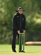10 May 2022; Umpire Mark Hawthorne sets bails during the Cricket Ireland Inter-Provincial Cup match between Leinster Lightning and Munster Reds at Pembroke Cricket Club in Dublin. Photo by Sam Barnes/Sportsfile