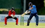 10 May 2022; Andrew Balbirnie of Leinster Lightning hits a four watched by Munster Reds wicket keeper PJ Moor during the Cricket Ireland Inter-Provincial Cup match between Leinster Lightning and Munster Reds at Pembroke Cricket Club in Dublin. Photo by Sam Barnes/Sportsfile