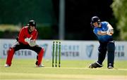 10 May 2022; Harry Tector of Leinster Lightning plays a shot watched by Munster Reds wicket keeper PJ Moor during the Cricket Ireland Inter-Provincial Cup match between Leinster Lightning and Munster Reds at Pembroke Cricket Club in Dublin. Photo by Sam Barnes/Sportsfile