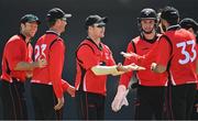 10 May 2022; Curtis Campher of Munster Reds, centre, celebrates with team-mates after catching out Andrew Balbirnie of Leinster Lightning during the Cricket Ireland Inter-Provincial Cup match between Leinster Lightning and Munster Reds at Pembroke Cricket Club in Dublin. Photo by Sam Barnes/Sportsfile