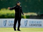 10 May 2022; Umpire Mark Hawthorne signals a four during the Cricket Ireland Inter-Provincial Cup match between Leinster Lightning and Munster Reds at Pembroke Cricket Club in Dublin. Photo by Sam Barnes/Sportsfile