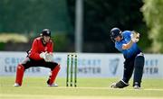 10 May 2022; Harry Tector of Leinster Lightning plays a shot watched by Munster Reds wicket keeper PJ Moor during the Cricket Ireland Inter-Provincial Cup match between Leinster Lightning and Munster Reds at Pembroke Cricket Club in Dublin. Photo by Sam Barnes/Sportsfile