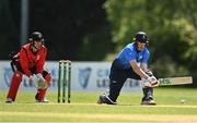 10 May 2022; Harry Tector of Leinster Lightning hits a four watched by Munster Reds wicket keeper PJ Moor during the Cricket Ireland Inter-Provincial Cup match between Leinster Lightning and Munster Reds at Pembroke Cricket Club in Dublin. Photo by Sam Barnes/Sportsfile