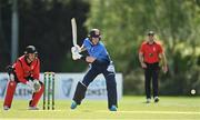 10 May 2022; George Dockrell of Leinster Lightning plays a shot watched by Munster Reds wicket keeper PJ Moor during the Cricket Ireland Inter-Provincial Cup match between Leinster Lightning and Munster Reds at Pembroke Cricket Club in Dublin. Photo by Sam Barnes/Sportsfile