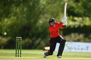 10 May 2022; PJ Moor of Munster Reds hits a four during the Cricket Ireland Inter-Provincial Cup match between Leinster Lightning and Munster Reds at Pembroke Cricket Club in Dublin. Photo by Sam Barnes/Sportsfile