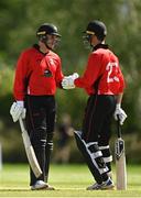 10 May 2022; PJ Moor, left and. Murray Commins of Munster Reds bump fists during Ireland Inter-Provincial Cup match between Leinster Lightning and Munster Reds at Pembroke Cricket Club in Dublin. Photo by Sam Barnes/Sportsfile