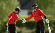 10 May 2022; PJ Moor of Munster Reds, right, is congratulated by Tyrone Kane after making his half-century during the Cricket Ireland Inter-Provincial Cup match between Leinster Lightning and Munster Reds at Pembroke Cricket Club in Dublin. Photo by Sam Barnes/Sportsfile