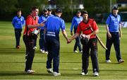 10 May 2022; Gareth Delany, left, and Matt Ford of Munster Reds, shake hands with Leinster Lightning players after their side won the Cricket Ireland Inter-Provincial Cup match between Leinster Lightning and Munster Reds at Pembroke Cricket Club in Dublin. Photo by Sam Barnes/Sportsfile
