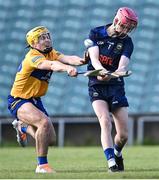 11 May 2022; Tipperary goalkeeper Eoin Horgan is tackled by Sam Scalon of Clare during the Electric Ireland Munster GAA Minor Hurling Championship Final match between Tipperary and Clare at TUS Gaelic Grounds in Limerick. Photo by Piaras Ó Mídheach/Sportsfile