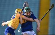 11 May 2022; Paddy Phelan of Tipperary is tackled by Sam Scanlon of Clare during the Electric Ireland Munster GAA Minor Hurling Championship Final match between Tipperary and Clare at TUS Gaelic Grounds in Limerick. Photo by Piaras Ó Mídheach/Sportsfile