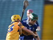 11 May 2022; Paddy Phelan of Tipperary is tackled by Sam Scanlon of Clare during the Electric Ireland Munster GAA Minor Hurling Championship Final match between Tipperary and Clare at TUS Gaelic Grounds in Limerick. Photo by Piaras Ó Mídheach/Sportsfile