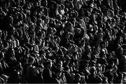 11 May 2022; (EDITOR'S NOTE; Image has been converted to black & white) Spectators shield their eyes from the sun during the Electric Ireland Munster GAA Minor Hurling Championship Final match between Tipperary and Clare at TUS Gaelic Grounds in Limerick. Photo by Piaras Ó Mídheach/Sportsfile