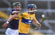 11 May 2022; Jack O'Neill of Clare in action against Sam O'Farrell of Tipperary during the Electric Ireland Munster GAA Minor Hurling Championship Final match between Tipperary and Clare at TUS Gaelic Grounds in Limerick. Photo by Piaras Ó Mídheach/Sportsfile