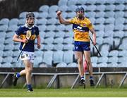 11 May 2022; Dylan Keane Hayes of Clare celebrates after scoring a point in injury-time of the second half, to equalise and send the game to extra-time, as Cathal English of Tipperary looks on during the Electric Ireland Munster GAA Minor Hurling Championship Final match between Tipperary and Clare at TUS Gaelic Grounds in Limerick. Photo by Piaras Ó Mídheach/Sportsfile