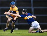 11 May 2022; Dylan Keane Hayes of Clare is tackled by Cathal English of Tipperary during the Electric Ireland Munster GAA Minor Hurling Championship Final match between Tipperary and Clare at TUS Gaelic Grounds in Limerick. Photo by Piaras Ó Mídheach/Sportsfile