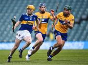 11 May 2022; Darragh McCarthy of Tipperary in action against Clare players Seán McMahon, left, and James Hegarty during the Electric Ireland Munster GAA Minor Hurling Championship Final match between Tipperary and Clare at TUS Gaelic Grounds in Limerick. Photo by Piaras Ó Mídheach/Sportsfile