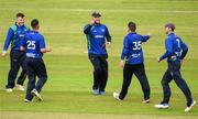 12 May 2022; William McClintock, centre, and North West Warriors team-mates celebrate dismissing Morgan Topping of Northern Knights during the Cricket Ireland Inter-Provincial Cup match between North West Warriors and Northern Knights at Bready Cricket Club in Magheramason, Tyrone. Photo by Stephen McCarthy/Sportsfile