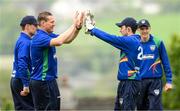 12 May 2022; Graham Hume of North West Warriors celebrates with team-mate Stephen Doheny, right, after bowling out Matthew Humphreys of Northern Knights during the Cricket Ireland Inter-Provincial Cup match between North West Warriors and Northern Knights at Bready Cricket Club in Magheramason, Tyrone. Photo by Stephen McCarthy/Sportsfile