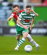 13 May 2022; Jack Byrne of Shamrock Rovers in action against Cameron Dummigan of Derry City during the SSE Airtricity League Premier Division match between Shamrock Rovers and Derry City at Tallaght Stadium in Dublin.  Photo by Stephen McCarthy/Sportsfile