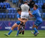 13 May 2022; Daniel Squires of Irish Universities is tackled by Daniel and David Hawkshaw of Leinster during the Development Match between Leinster Rugby A and Irish Universities XV at Energia Park in Dublin. Photo by Harry Murphy/Sportsfile