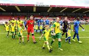 14 May 2022; Team captains Ken Hoey of Rockmount AFC, left, and Tayem Dinamumenga of Bluebell United lead their sides out before during the FAI Centenary Intermediate Cup Final 2021/2022 match between Rockmount AFC and Bluebell United at Turner's Cross in Cork. Photo by Seb Daly/Sportsfile