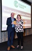 14 May 2022; Scoil Phobail Sliabh Luachra Rathmore coach Jim Hughes collects the Boys A School of the Year award from Chair of the Post Primary Schools Committee, Marie O’Toole, on behalf of Scoil Phobail Sliabh Luachra, Rathmore, Kerry, during the 2021/22 Basketball Ireland Annual Awards and Hall of Fame ceremony in Dublin on Saturday at Royal Marine Hotel in Dun Laoghaire, Dublin. Photo by Sam Barnes/Sportsfile