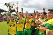 14 May 2022; Rockmount AFC captain Ken Hoey, left, lifts the Pat O'Brien Intermediate Challenge Cup as he celebrates his teammates after their side's victory in the FAI Centenary Intermediate Cup Final 2021/2022 match between Rockmount AFC and Bluebell United at Turner's Cross in Cork. Photo by Seb Daly/Sportsfile