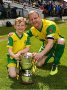 14 May 2022; Rockmount AFC captain Ken Hoey with his son Kyle, age 9, after their side's victory in the FAI Centenary Intermediate Cup Final 2021/2022 match between Rockmount AFC and Bluebell United at Turner's Cross in Cork. Photo by Seb Daly/Sportsfile