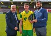 14 May 2022; Luke Casey of Rockmount AFC is presented with his Player of the Match award by FAI President Gerry McAnaney, left, and John Finnegan of Munster FA after his side's victory in the FAI Centenary Intermediate Cup Final 2021/2022 match between Rockmount AFC and Bluebell United at Turner's Cross in Cork. Photo by Seb Daly/Sportsfile
