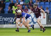14 May 2022; Ben Conroy of Laois is tackled by Tom Monaghan and Padraic Mannion of Galway during the Leinster GAA Hurling Senior Championship Round 4 match between Laois and Galway at MW Hire O’Moore Park in Portlaoise, Laois. Photo by Ray McManus/Sportsfile