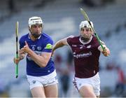 14 May 2022; Ryan Mullaney of Laois is tackled by Joseph Cooney of Galway during the Leinster GAA Hurling Senior Championship Round 4 match between Laois and Galway at MW Hire O’Moore Park in Portlaoise, Laois. Photo by Ray McManus/Sportsfile