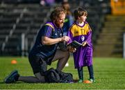 14 May 2022; Wexford supporters Ivan Lynch, and his son Sam, aged 6, from Gorey, Co Wexford, read the match programme ahead of the Leinster GAA Hurling Senior Championship Round 4 match between Westmeath and Wexford at TEG Cusack Park in Mullingar, Westmeath. Photo by Daire Brennan/Sportsfile