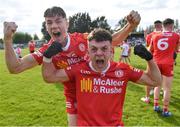 14 May 2022; Tyrone players Shea O'Hare, left, and Michael Rafferty celebrate after their side's victory in the EirGrid GAA Football All-Ireland Under 20 Championship Final match between Kildare and Tyrone at Avant Money Páirc Seán Mac Diarmada, Carrick-on-Shannon in Leitrim. Photo by Piaras Ó Mídheach/Sportsfile