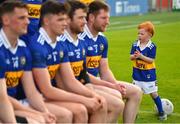 14 May 2022; The Tipperary team are applauded onto the field by 4-year-old Iarla McLoughlin before the Munster GAA Senior Football Championship Semi-Final match between Tipperary and Limerick at FBD Semple Stadium in Thurles, Tipperary. Photo by Diarmuid Greene/Sportsfile