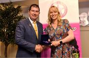 14 May 2022; Sorcha Furlong of St Brigid’s GAA club in Dublin is presented with her graduation medallion by Uachtarán Cumann Peil Gael na mBan, Mícheál Naughton, during the Learn to Lead LGFA Female Leadership Programme graduation evening at the Bonnington Hotel in Dublin. The Learn to Lead programme was devised to develop the next generation of leaders within Ladies Gaelic Football. Photo by Brendan Moran/Sportsfile