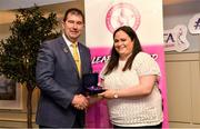 14 May 2022; Síle Moynihan of St. Ailbes GAA club in Limerick is presented with her graduation medallion by Uachtarán Cumann Peil Gael na mBan, Mícheál Naughton, during the Learn to Lead LGFA Female Leadership Programme graduation evening at the Bonnington Hotel in Dublin. The Learn to Lead programme was devised to develop the next generation of leaders within Ladies Gaelic Football. Photo by Brendan Moran/Sportsfile