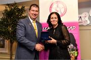 14 May 2022; Martina McCafferty of Steelstown Brian Ogs GAA club in Derry is presented with her graduation medallion by Uachtarán Cumann Peil Gael na mBan, Mícheál Naughton, during the Learn to Lead LGFA Female Leadership Programme graduation evening at the Bonnington Hotel in Dublin. The Learn to Lead programme was devised to develop the next generation of leaders within Ladies Gaelic Football. Photo by Brendan Moran/Sportsfile