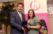 14 May 2022; Yvonne Duffy of Mullahoran LGFA club in Cavan is presented with her graduation medallion by Uachtarán Cumann Peil Gael na mBan, Mícheál Naughton, during the Learn to Lead LGFA Female Leadership Programme graduation evening at the Bonnington Hotel in Dublin. The Learn to Lead programme was devised to develop the next generation of leaders within Ladies Gaelic Football. Photo by Brendan Moran/Sportsfile