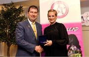 14 May 2022; Pamela Hayden of Old Leighlin GAA club in Carlow is presented with her graduation medallion by Uachtarán Cumann Peil Gael na mBan, Mícheál Naughton, during the Learn to Lead LGFA Female Leadership Programme graduation evening at the Bonnington Hotel in Dublin. The Learn to Lead programme was devised to develop the next generation of leaders within Ladies Gaelic Football. Photo by Brendan Moran/Sportsfile