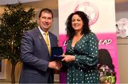 14 May 2022; Ciara Gilroy of Tullylish GAA club in Down is presented with her graduation medallion by Uachtarán Cumann Peil Gael na mBan, Mícheál Naughton, during the Learn to Lead LGFA Female Leadership Programme graduation evening at the Bonnington Hotel in Dublin. The Learn to Lead programme was devised to develop the next generation of leaders within Ladies Gaelic Football. Photo by Brendan Moran/Sportsfile