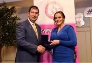 14 May 2022; Veronica Murphy of Corofin GAA club in Galway is presented with her graduation medallion by Uachtarán Cumann Peil Gael na mBan, Mícheál Naughton, during the Learn to Lead LGFA Female Leadership Programme graduation evening at the Bonnington Hotel in Dublin. The Learn to Lead programme was devised to develop the next generation of leaders within Ladies Gaelic Football. Photo by Brendan Moran/Sportsfile